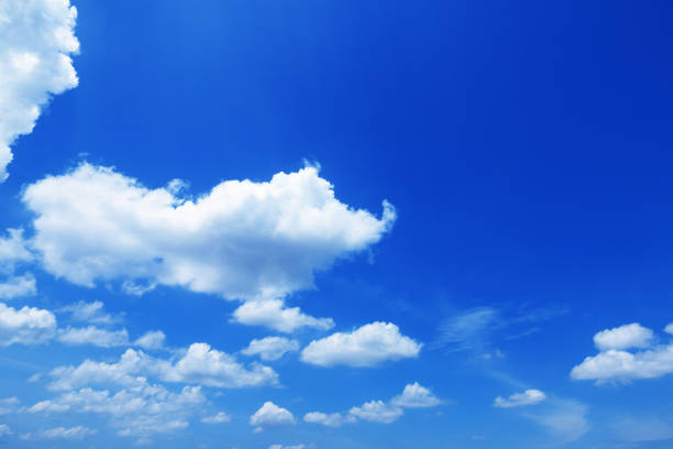 istock beautiful white clouds on blue sky for background and design 696803658