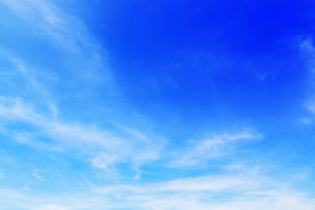 istock beautiful soft white clouds on blue sky for background and design 696806048