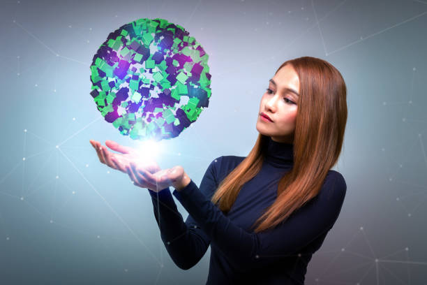 istock young woman looking at a abstract object floating on her hands, communication network concept. 696806916