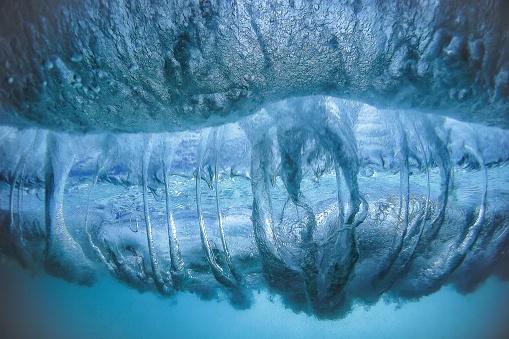 The fusion of water and air beneath a wave
