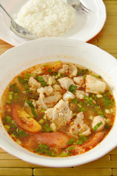 istock spicy pork bone tamarind and Thai herbs soup with rice 696813966