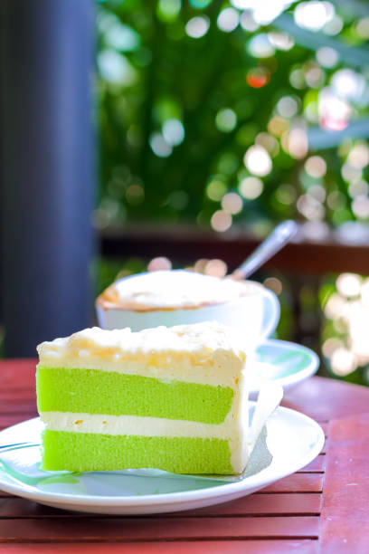 istock piece of cake on a wooden table 696814310