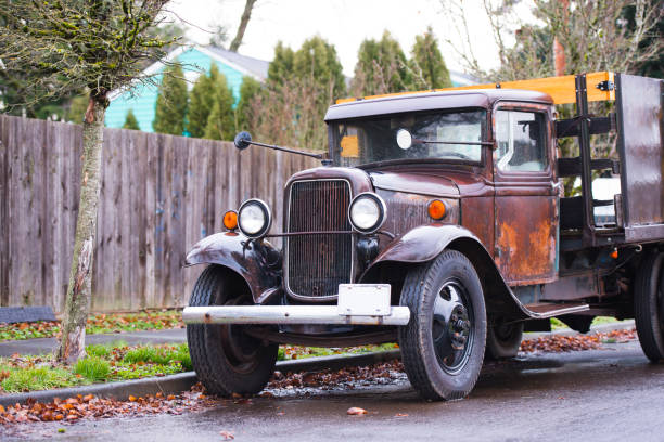istock Old retro rusty truck on the road in the rain 696823820