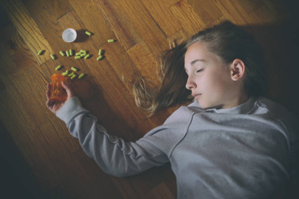 Girl is Unconscious after taking Prescription Drugs stock photo