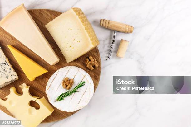 Selection Of Cheeses With Corkscrew Cork And Copyspace Stock Photo - Download Image Now