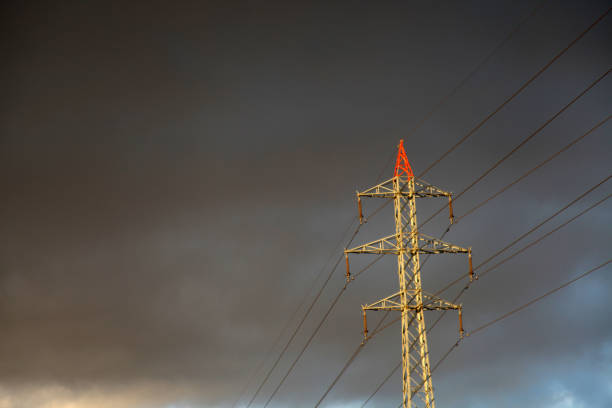 istock Electricity industry - high voltage tower in a row 696844844
