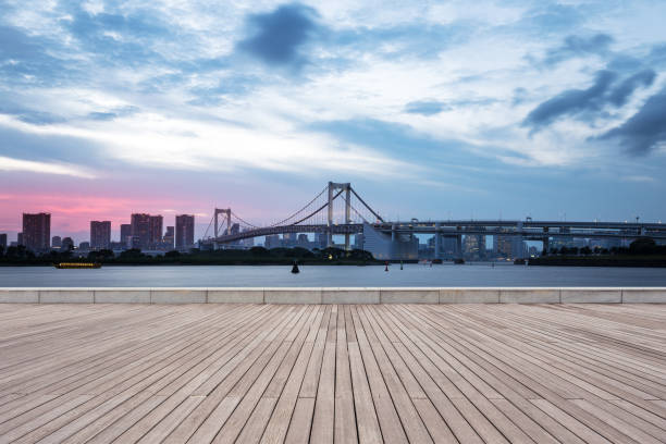 istock empty wooden pedestrians sidewalk with modern suspension bridge 696846908