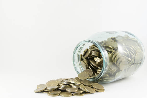 istock Money in a glass jar on a white background 696847384