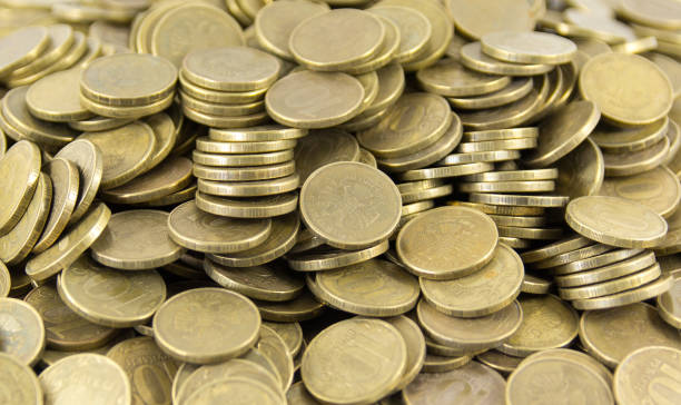 istock A lot of coins on a white background 696847424