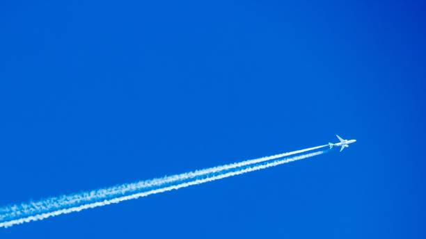istock Passenger airplane in the sky on sunny cloudless day 696850074