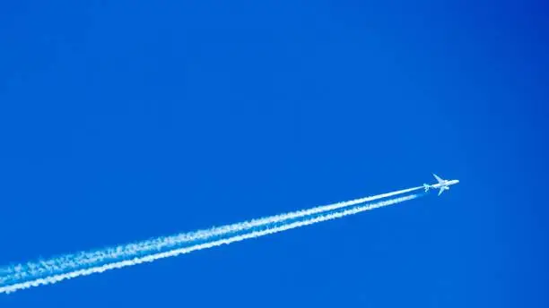 Passenger airplane in the sky on sunny cloudless day