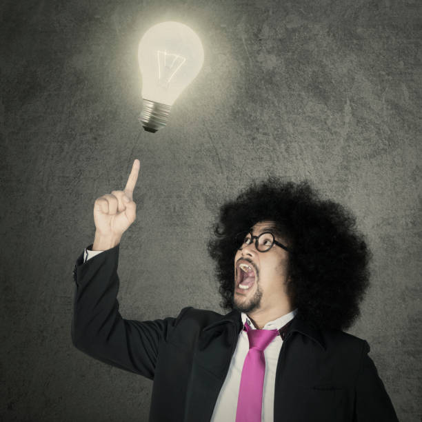 istock Afro male entrepreneur and light bulb 696853434