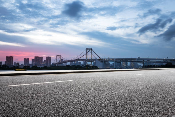 istock empty road with suspension bridge in modern city 696855968