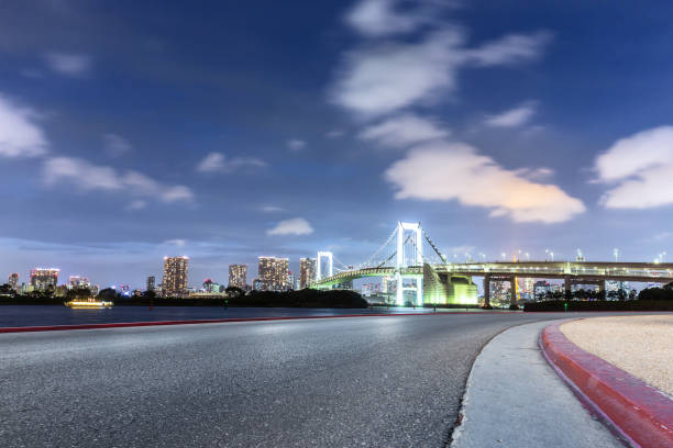 istock empty road with suspension bridge in modern city 696857014