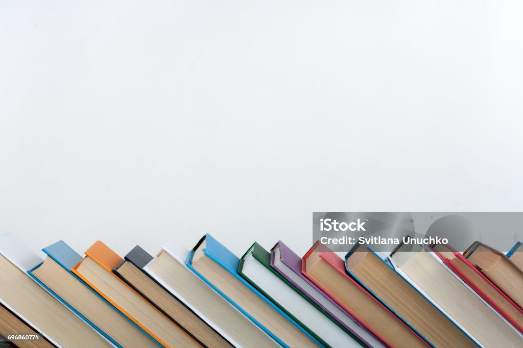 Stack of colorful books. Education background. Back to school. Book, hardback colorful books on wooden table. Education business concept. Copy space for text Stack Stock Photo