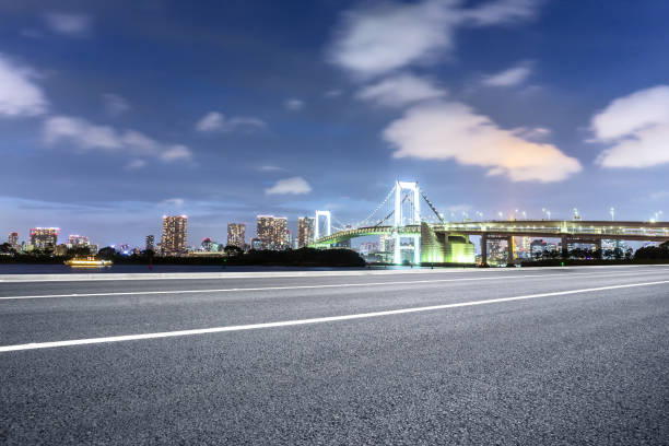 istock empty road with suspension bridge in modern city 696861088
