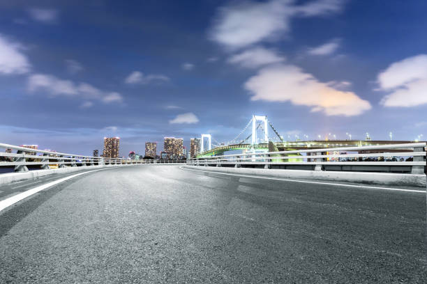 istock empty road with suspension bridge in modern city 696861658