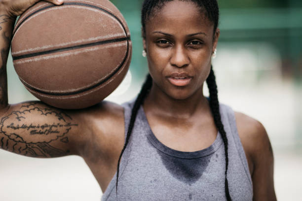istock Tired young woman holding  the ball 696861790