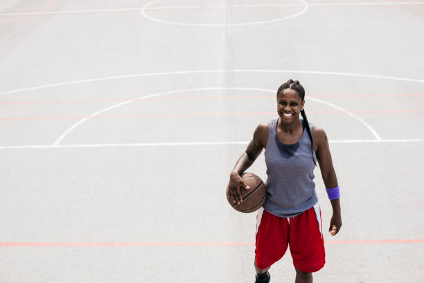 istock Woman with basketball ball 696861792