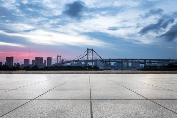 istock empty pedestrians sidewalk with modern suspension bridge 696866046