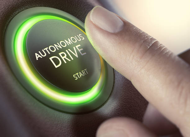 Autonomous Drive, Self-Driving Vehicle Finger pressing a push button to start a self-driving car. Composite image between a hand photography and a 3D background. driverless car stock pictures, royalty-free photos & images