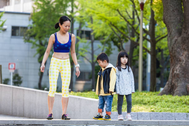 istock Yoga with kids in a park 696868690