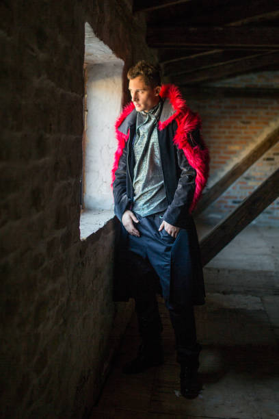 istock Attractive male model looking through the window. 696869238