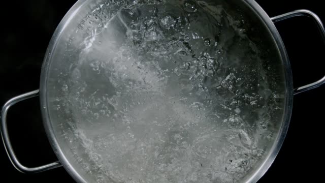 Opening the lid of boiling pot - Top shot