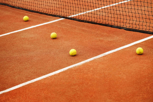 istock Ball on tennis court background 696872764