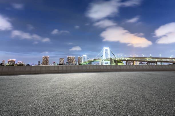 istock empty road with suspension bridge in modern city 696876816