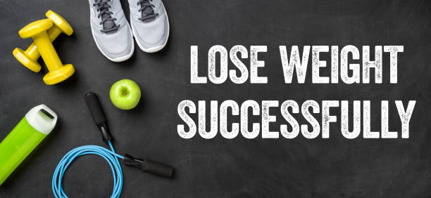 istock Fitness equipment on a dark background - Lose weight successfully 696876988