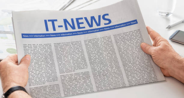 istock Man reading newspaper with the headline IT-News 696877482