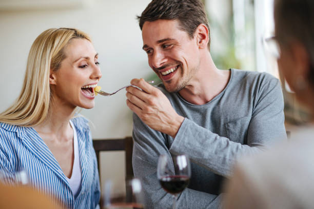 istock Husband feeding his wife 696881268