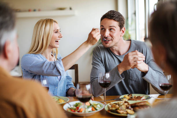 istock Wife feeding her husband 696881272