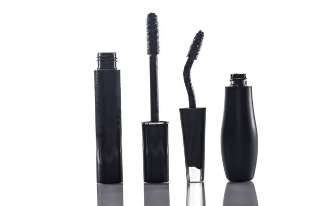 istock Black mascara with applicator brush isolated on white 696881858