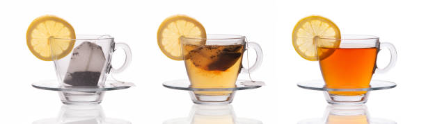 istock Set of three tea cups with lemon slice and tea bag isolated on white background, make a tea concept 696884664
