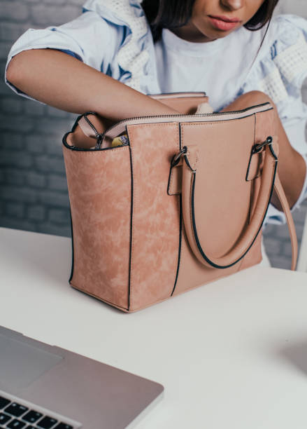 istock Businesswoman checking her purse 696885520