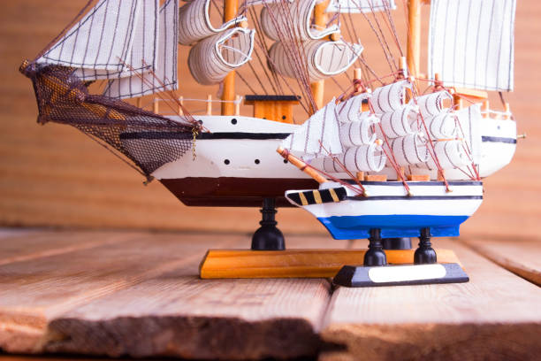 istock model of ships on the wooden table 696886246