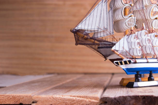 istock model of ships on the wooden table 696886250