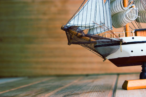 istock model of ships on the wooden table 696886276