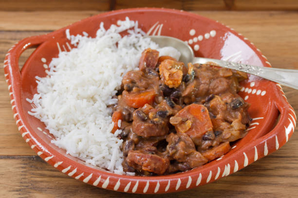 istock typical portuguese dish feijoada with rice in ceramic bowl on brown wooden background 696888918