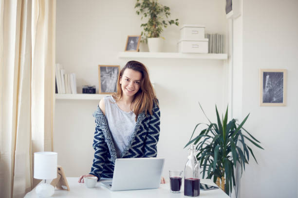 istock Girl using laptop in morning 696889182