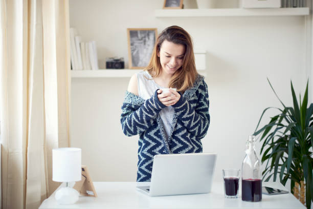 istock Girl using laptop in morning 696889228