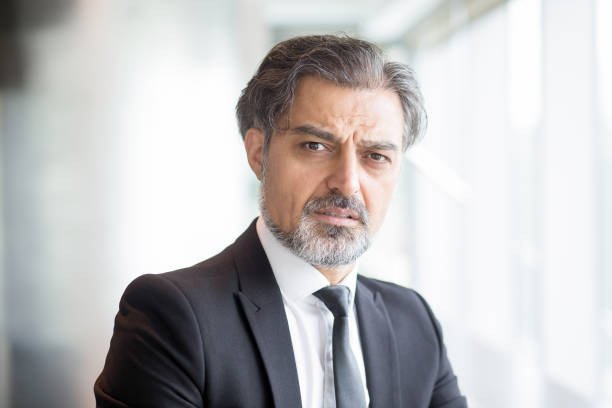 istock Confused senior businessman wearing suit 696889800