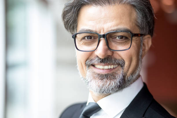 istock Portrait of successful man smiling at camera 696889854