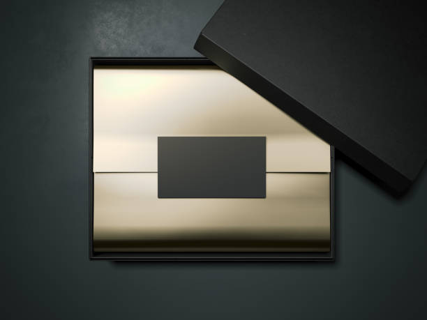 istock Black box with gold wrapping paper and business card. 3d rendering 696892362
