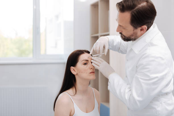 istock Motivated elegant lady visiting beautician for special procedure 696897710