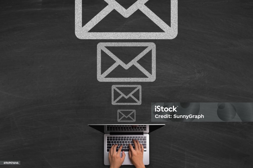 Email Concept With Laptop On Blackboard Email concept with hands typing laptop on the blackboard background. Chalkboard - Visual Aid Stock Photo