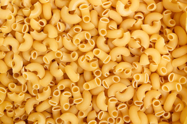 istock Raw pasta background close up macro meal 696905284
