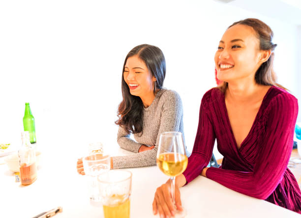istock Group of Multi Ethnic Friends Talking in the Kitchen at a Party 696907452